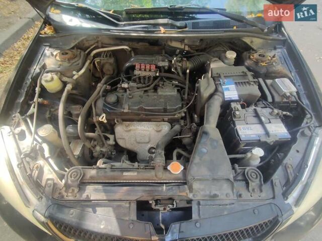 Чорний Міцубісі Lancer, об'ємом двигуна 1.6 л та пробігом 335 тис. км за 3100 $, фото 16 на Automoto.ua