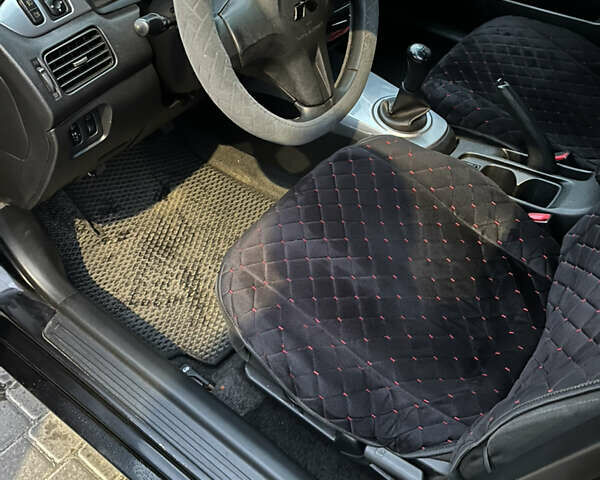 Чорний Міцубісі Lancer, об'ємом двигуна 1.6 л та пробігом 277 тис. км за 3900 $, фото 12 на Automoto.ua