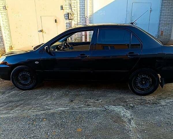 Черный Мицубиси Лансер, объемом двигателя 1.6 л и пробегом 230 тыс. км за 4700 $, фото 3 на Automoto.ua