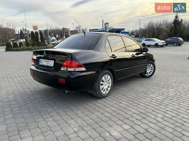Чорний Міцубісі Lancer, об'ємом двигуна 1.58 л та пробігом 344 тис. км за 3999 $, фото 3 на Automoto.ua