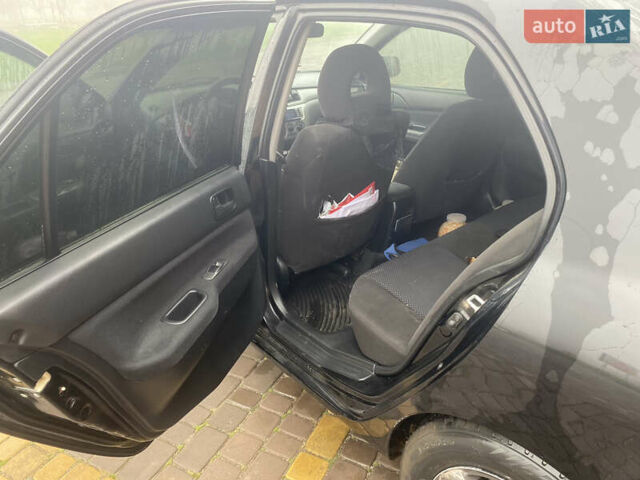 Черный Мицубиси Лансер, объемом двигателя 1.58 л и пробегом 211 тыс. км за 6333 $, фото 35 на Automoto.ua