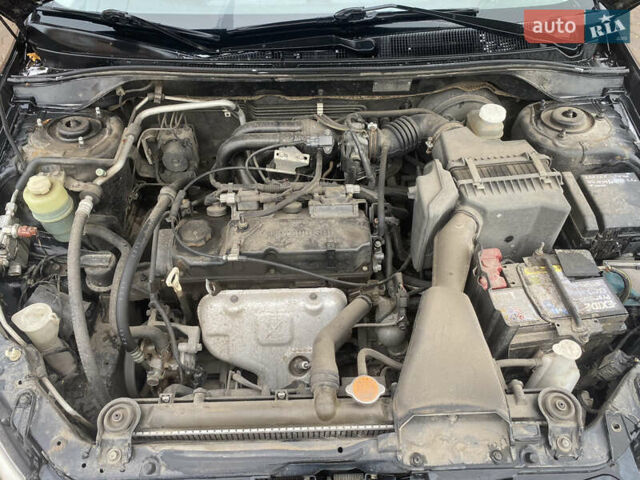 Черный Мицубиси Лансер, объемом двигателя 1.58 л и пробегом 211 тыс. км за 6333 $, фото 33 на Automoto.ua