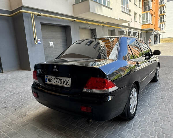 Черный Мицубиси Лансер, объемом двигателя 1.58 л и пробегом 163 тыс. км за 5699 $, фото 11 на Automoto.ua