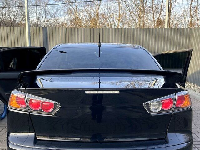 Чорний Міцубісі Lancer, об'ємом двигуна 2 л та пробігом 255 тис. км за 7200 $, фото 2 на Automoto.ua