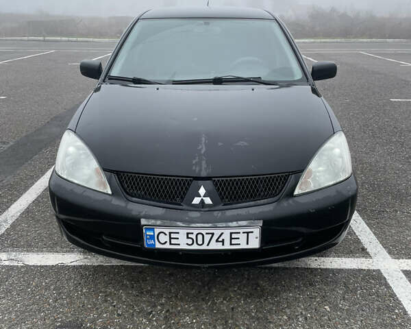 Черный Мицубиси Лансер, объемом двигателя 1.58 л и пробегом 214 тыс. км за 4400 $, фото 1 на Automoto.ua