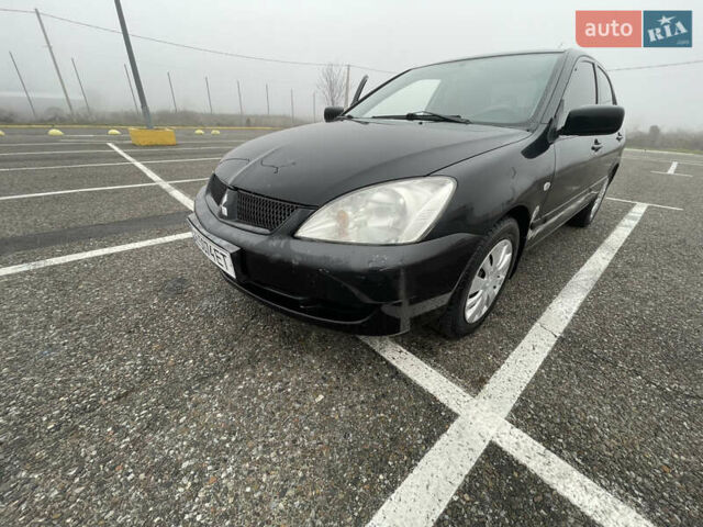 Черный Мицубиси Лансер, объемом двигателя 1.58 л и пробегом 214 тыс. км за 4400 $, фото 13 на Automoto.ua