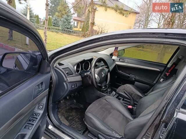 Черный Мицубиси Лансер, объемом двигателя 2 л и пробегом 200 тыс. км за 5100 $, фото 10 на Automoto.ua