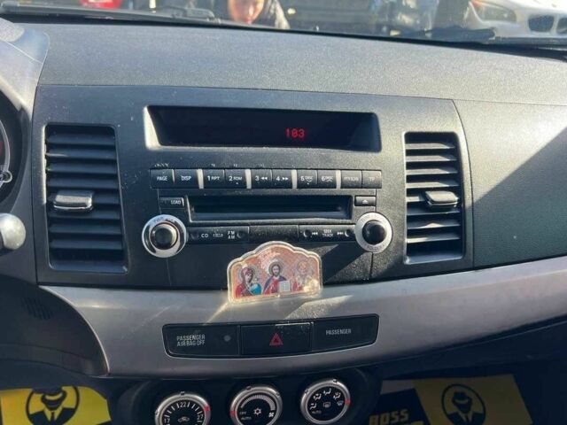 Черный Мицубиси Лансер, объемом двигателя 2 л и пробегом 215 тыс. км за 7000 $, фото 11 на Automoto.ua