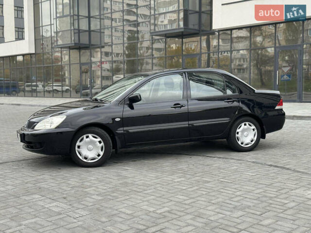 Чорний Міцубісі Lancer, об'ємом двигуна 1.58 л та пробігом 128 тис. км за 5999 $, фото 3 на Automoto.ua