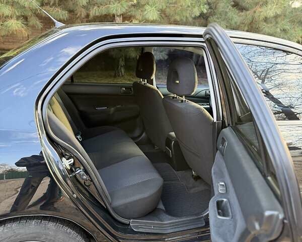 Чорний Міцубісі Lancer, об'ємом двигуна 1.6 л та пробігом 98 тис. км за 5600 $, фото 8 на Automoto.ua