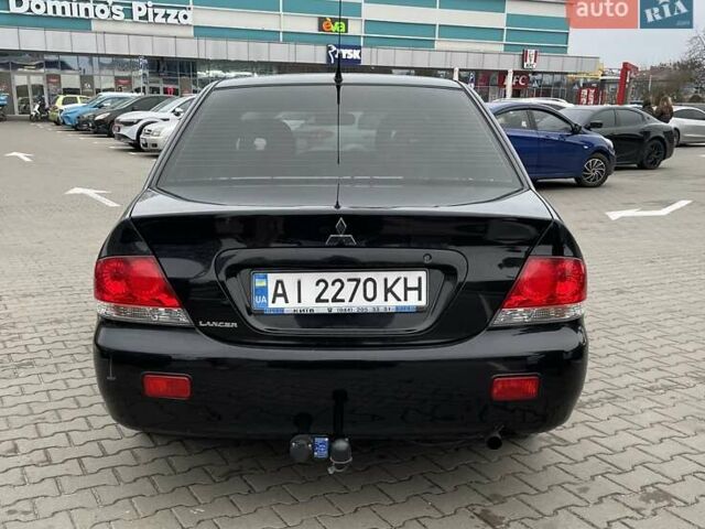 Чорний Міцубісі Lancer, об'ємом двигуна 1.6 л та пробігом 186 тис. км за 5500 $, фото 4 на Automoto.ua