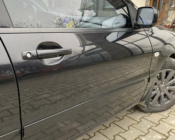 Чорний Міцубісі Lancer, об'ємом двигуна 1.58 л та пробігом 287 тис. км за 4750 $, фото 2 на Automoto.ua
