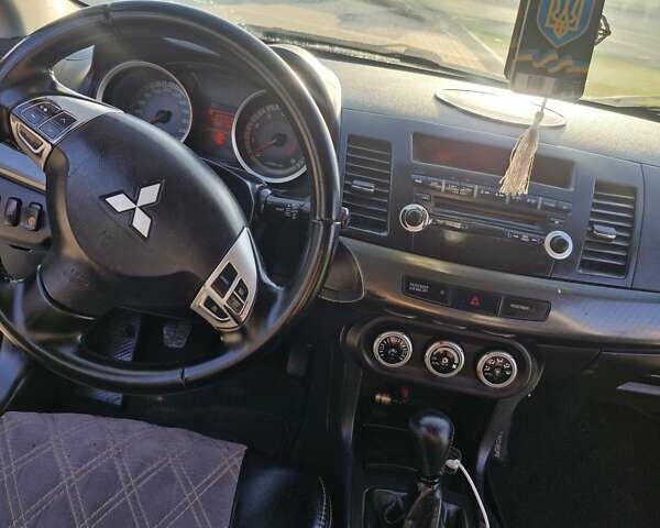 Черный Мицубиси Лансер, объемом двигателя 2 л и пробегом 184 тыс. км за 6999 $, фото 23 на Automoto.ua