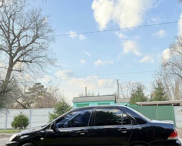 Чорний Міцубісі Lancer, об'ємом двигуна 1.6 л та пробігом 98 тис. км за 5600 $, фото 5 на Automoto.ua