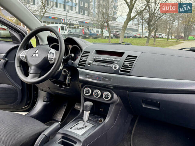 Черный Мицубиси Лансер, объемом двигателя 2 л и пробегом 221 тыс. км за 6750 $, фото 34 на Automoto.ua