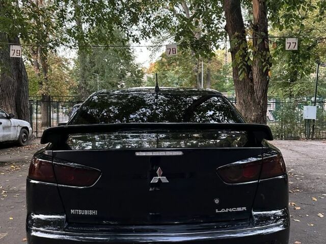 Чорний Міцубісі Lancer, об'ємом двигуна 2 л та пробігом 253 тис. км за 7300 $, фото 4 на Automoto.ua