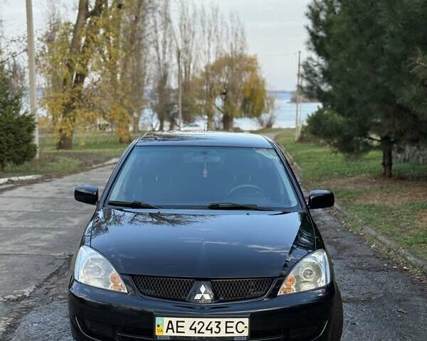 Чорний Міцубісі Lancer, об'ємом двигуна 1.6 л та пробігом 98 тис. км за 5600 $, фото 12 на Automoto.ua