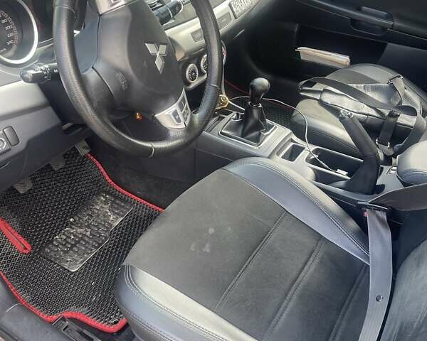 Черный Мицубиси Лансер, объемом двигателя 2 л и пробегом 201 тыс. км за 7000 $, фото 4 на Automoto.ua