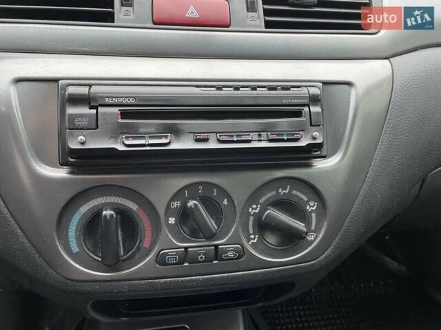 Чорний Міцубісі Lancer, об'ємом двигуна 1.6 л та пробігом 186 тис. км за 5500 $, фото 15 на Automoto.ua