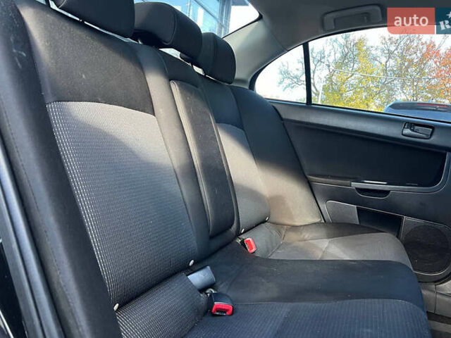 Черный Мицубиси Лансер, объемом двигателя 2 л и пробегом 215 тыс. км за 7000 $, фото 18 на Automoto.ua