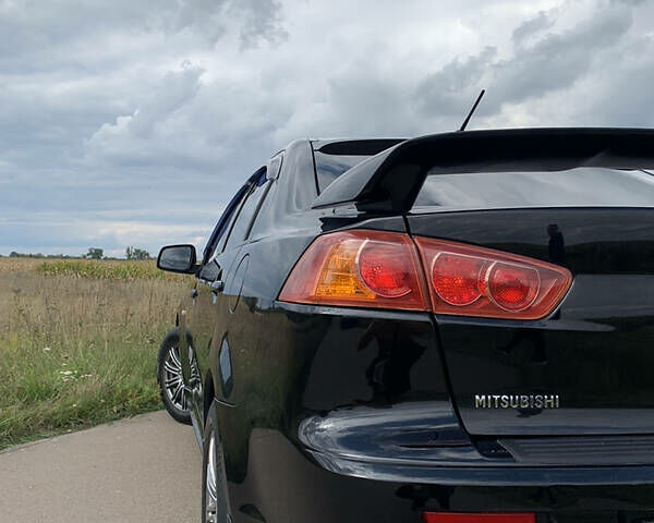 Чорний Міцубісі Lancer, об'ємом двигуна 2 л та пробігом 200 тис. км за 7200 $, фото 15 на Automoto.ua