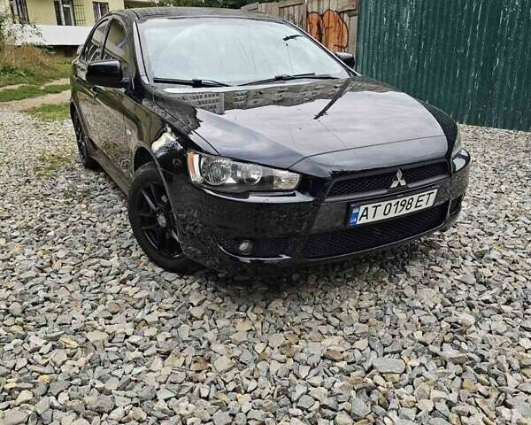 Черный Мицубиси Лансер, объемом двигателя 2 л и пробегом 214 тыс. км за 6100 $, фото 6 на Automoto.ua