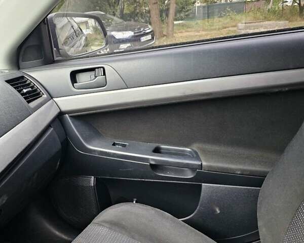 Чорний Міцубісі Lancer, об'ємом двигуна 2 л та пробігом 214 тис. км за 5900 $, фото 12 на Automoto.ua