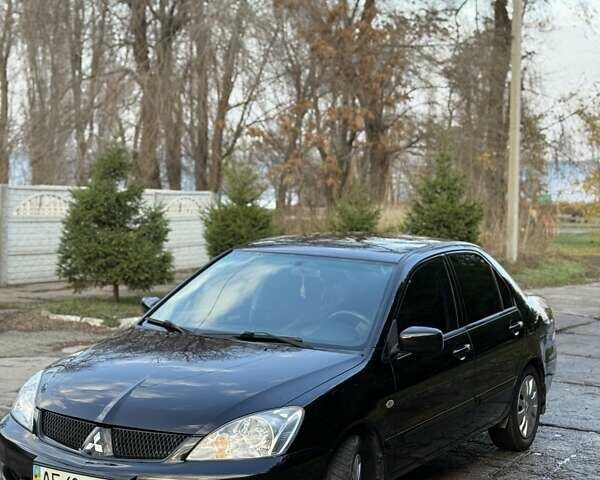 Чорний Міцубісі Lancer, об'ємом двигуна 1.6 л та пробігом 98 тис. км за 5600 $, фото 11 на Automoto.ua