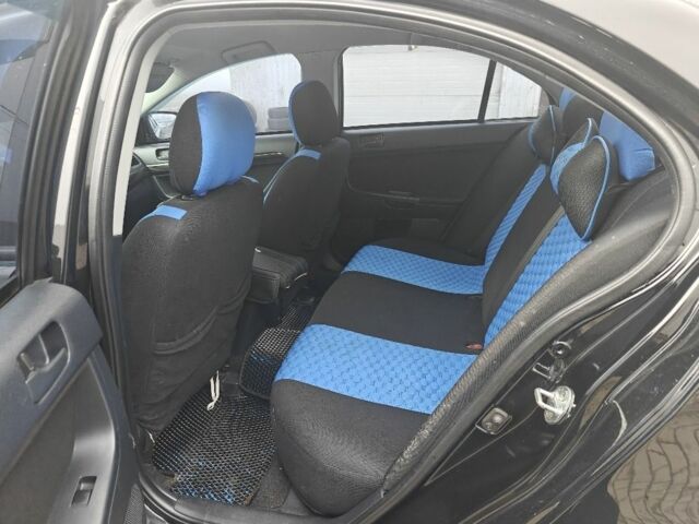 Черный Мицубиси Лансер, объемом двигателя 2 л и пробегом 228 тыс. км за 7000 $, фото 4 на Automoto.ua