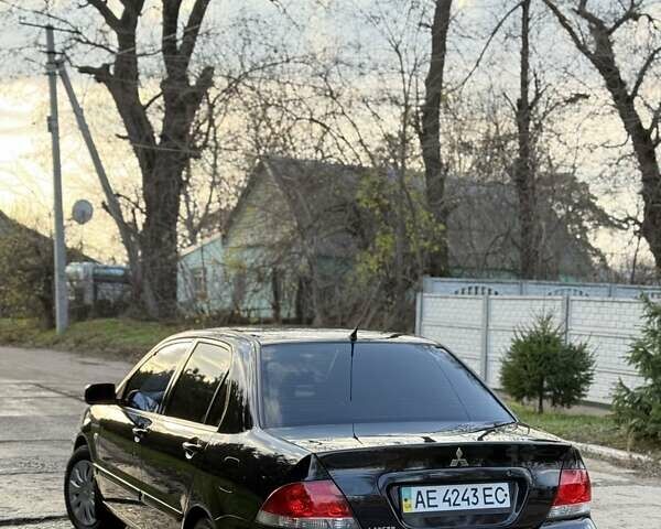Чорний Міцубісі Lancer, об'ємом двигуна 1.6 л та пробігом 98 тис. км за 5600 $, фото 4 на Automoto.ua