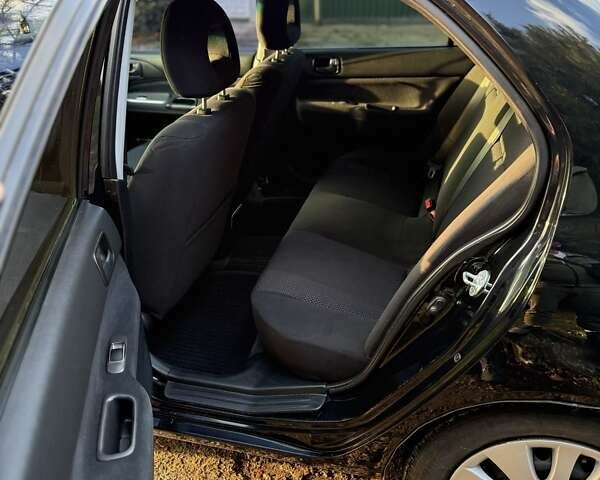 Чорний Міцубісі Lancer, об'ємом двигуна 1.6 л та пробігом 98 тис. км за 5600 $, фото 22 на Automoto.ua