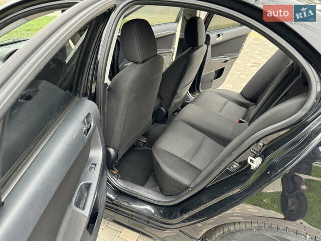 Черный Мицубиси Лансер, объемом двигателя 2 л и пробегом 221 тыс. км за 6750 $, фото 40 на Automoto.ua