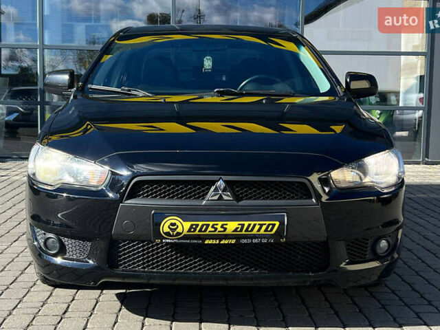 Черный Мицубиси Лансер, объемом двигателя 2 л и пробегом 215 тыс. км за 7000 $, фото 1 на Automoto.ua