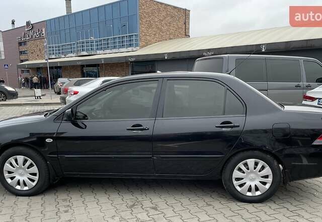 Чорний Міцубісі Lancer, об'ємом двигуна 1.6 л та пробігом 186 тис. км за 5500 $, фото 1 на Automoto.ua