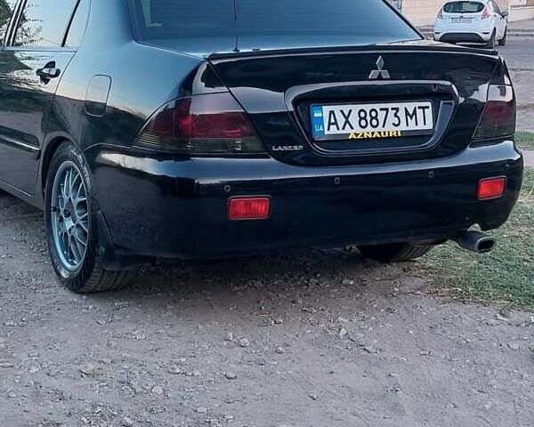Чорний Міцубісі Lancer, об'ємом двигуна 1.58 л та пробігом 345 тис. км за 4500 $, фото 2 на Automoto.ua