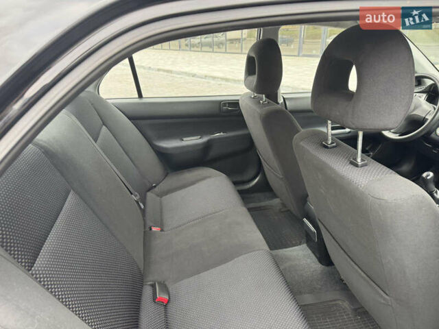 Чорний Міцубісі Lancer, об'ємом двигуна 1.58 л та пробігом 128 тис. км за 5999 $, фото 21 на Automoto.ua