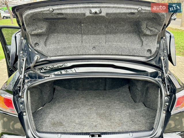 Черный Мицубиси Лансер, объемом двигателя 2 л и пробегом 221 тыс. км за 6750 $, фото 30 на Automoto.ua