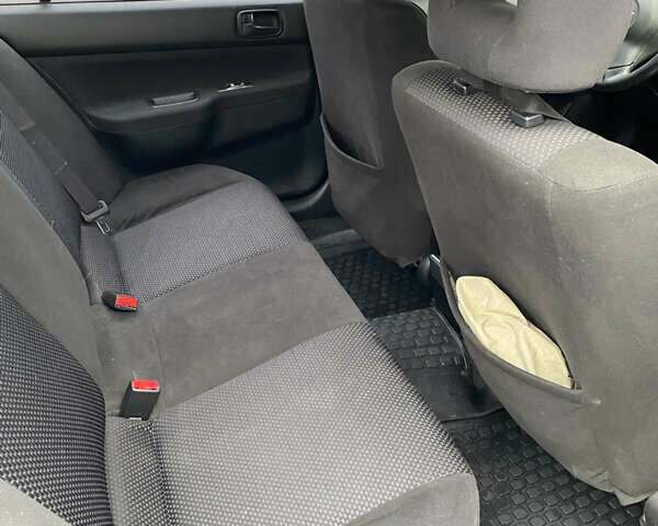 Чорний Міцубісі Lancer, об'ємом двигуна 1.58 л та пробігом 287 тис. км за 4750 $, фото 4 на Automoto.ua