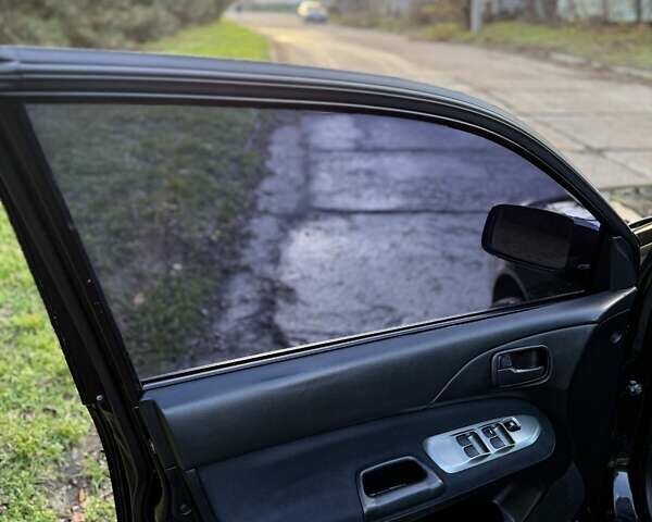 Чорний Міцубісі Lancer, об'ємом двигуна 1.6 л та пробігом 98 тис. км за 5600 $, фото 6 на Automoto.ua