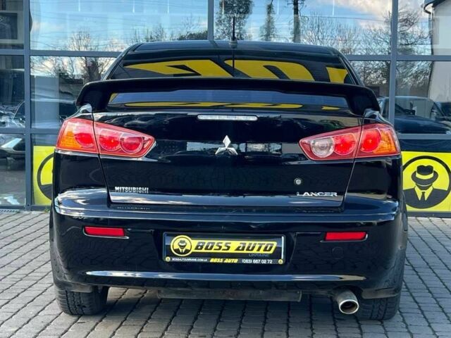 Черный Мицубиси Лансер, объемом двигателя 2 л и пробегом 215 тыс. км за 7000 $, фото 5 на Automoto.ua