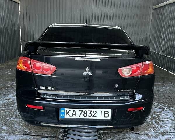 Черный Мицубиси Лансер, объемом двигателя 2 л и пробегом 280 тыс. км за 7000 $, фото 1 на Automoto.ua