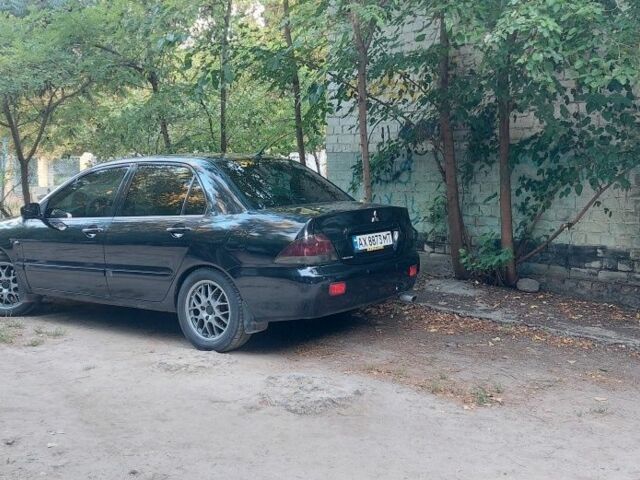 Черный Мицубиси Лансер, объемом двигателя 1.6 л и пробегом 340 тыс. км за 4500 $, фото 2 на Automoto.ua