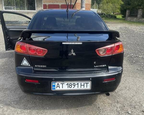 Черный Мицубиси Лансер, объемом двигателя 2 л и пробегом 201 тыс. км за 7000 $, фото 2 на Automoto.ua