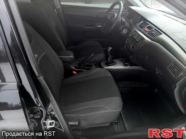 Черный Мицубиси Лансер, объемом двигателя 1.6 л и пробегом 94 тыс. км за 6200 $, фото 4 на Automoto.ua