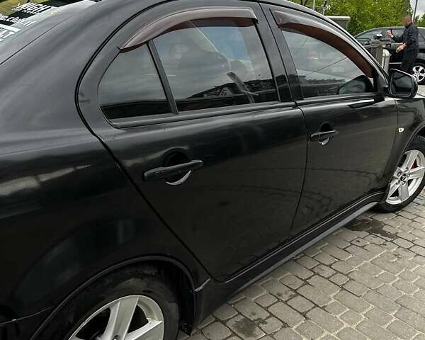 Чорний Міцубісі Lancer, об'ємом двигуна 2 л та пробігом 234 тис. км за 6199 $, фото 6 на Automoto.ua