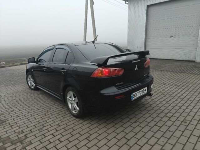 Черный Мицубиси Лансер, объемом двигателя 2 л и пробегом 228 тыс. км за 7000 $, фото 3 на Automoto.ua