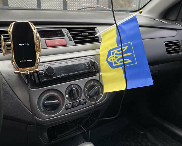 Чорний Міцубісі Lancer, об'ємом двигуна 1.58 л та пробігом 287 тис. км за 4750 $, фото 11 на Automoto.ua