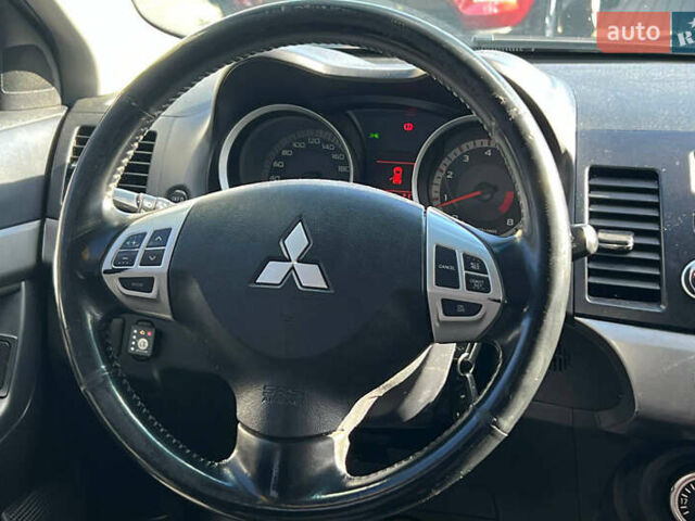 Черный Мицубиси Лансер, объемом двигателя 2 л и пробегом 215 тыс. км за 7000 $, фото 14 на Automoto.ua