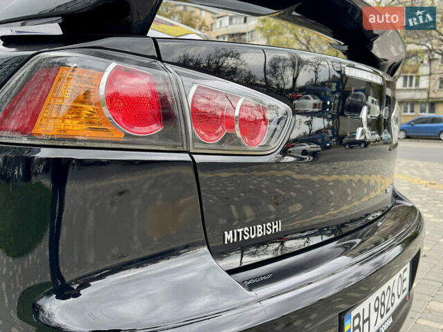 Черный Мицубиси Лансер, объемом двигателя 2 л и пробегом 221 тыс. км за 6750 $, фото 32 на Automoto.ua