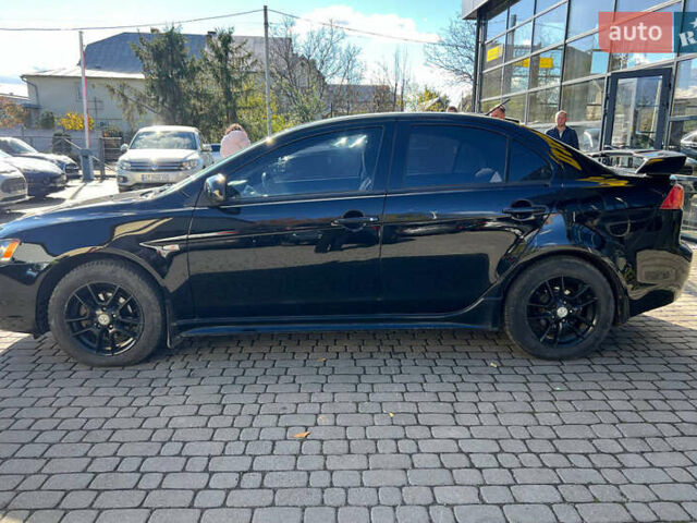 Черный Мицубиси Лансер, объемом двигателя 2 л и пробегом 215 тыс. км за 7000 $, фото 3 на Automoto.ua